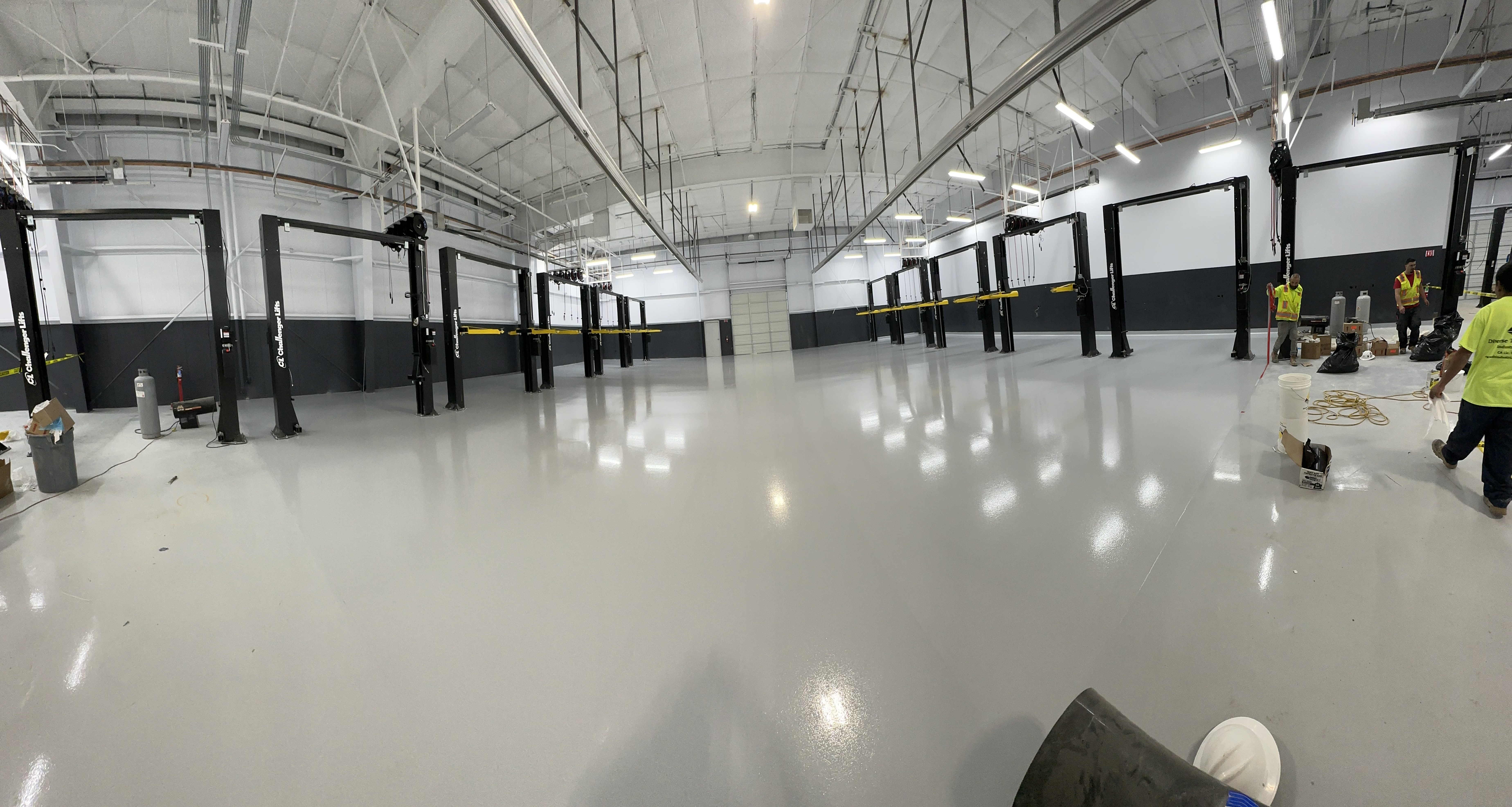 Nissan Dealership California - broadcast epoxy service bay flooring with polyurethane topcoat Nissan Dealership California - broadcast epoxy service bay flooring with polyurethane topcoat